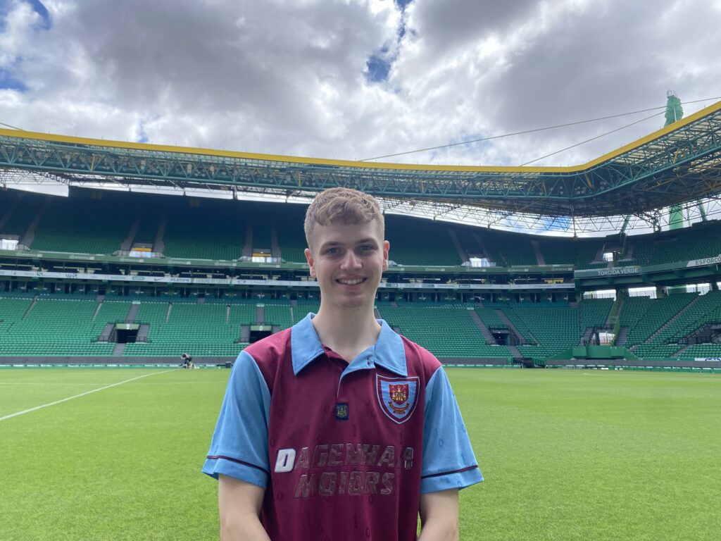 Frankie Levin in a West Ham top standing pitch side at the Sporting CP Stadium